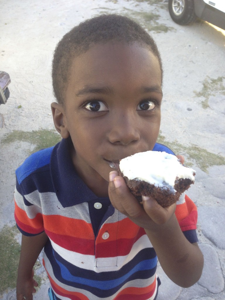 Local Bahamian boy enjoying Roxane's Muffins
